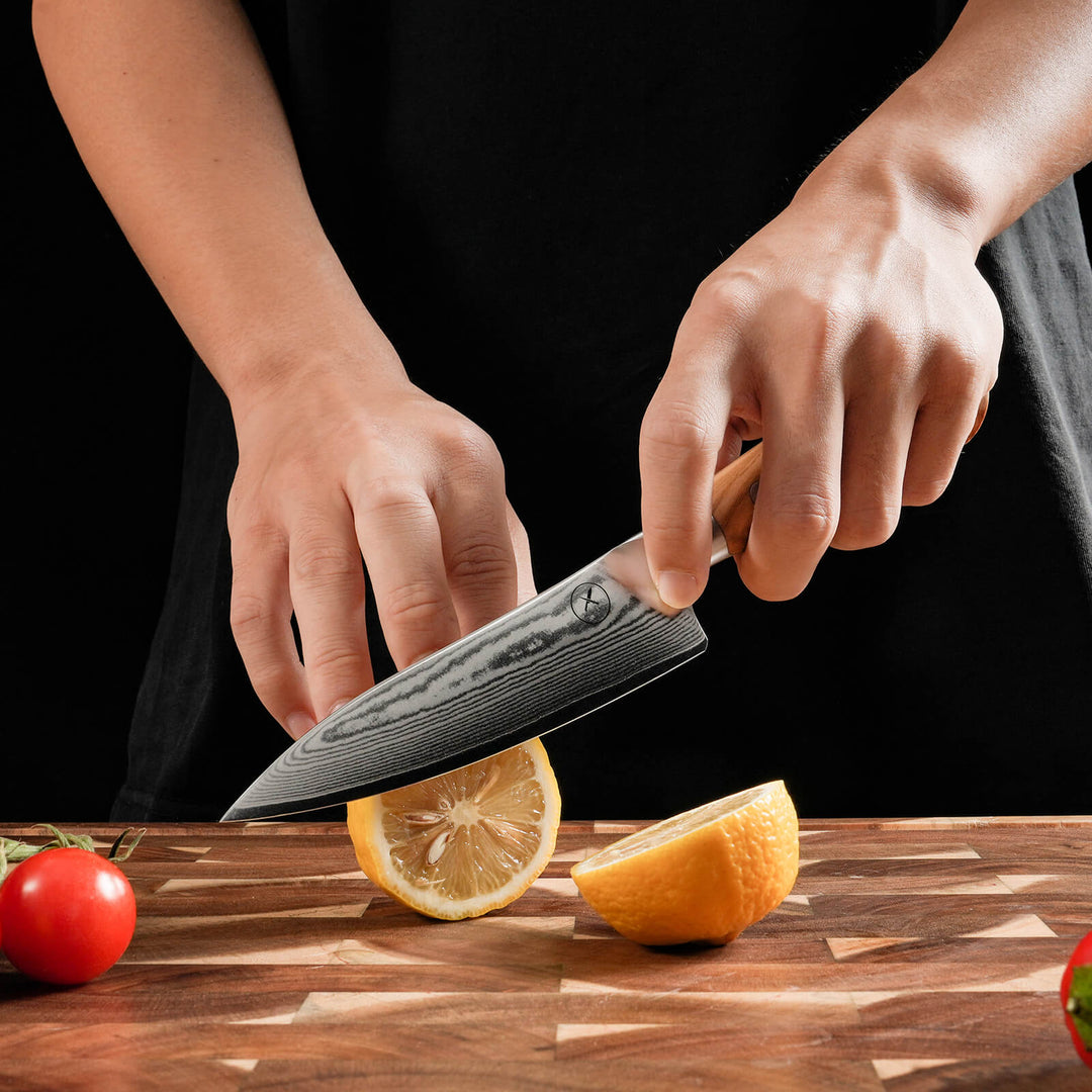 Damascus Utility knife 5-inch blade in use – 67-layer Damascus steel by Damastshop
